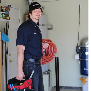 water-heater-installer-draining-a-water-heater a water heater technician ready to drain a water heater